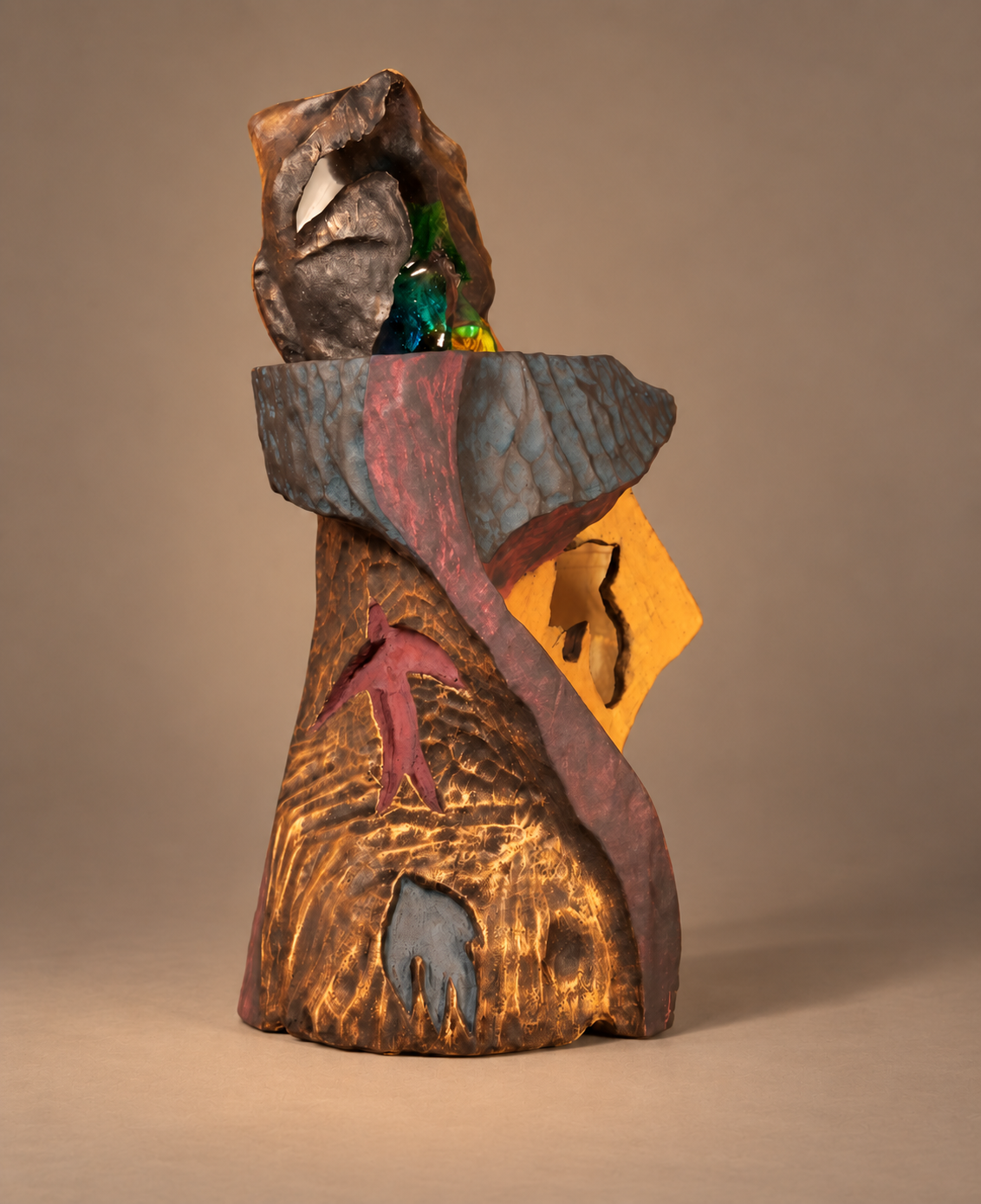 Front view of The Indigo Swifts sculpture in cast crystal glass and gilded willow timber against a warm grey studio background